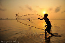 Vietnamese fisherman at sunset