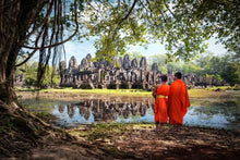 Angkor Wat - Monks looking at the Temple